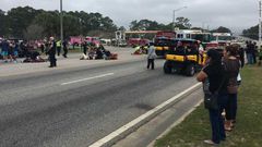 Emergency crews respond to the scene of the parade, which was canceled