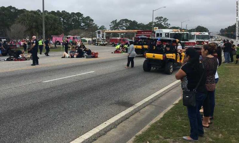 Emergency crews respond to the scene of the parade, which was canceled