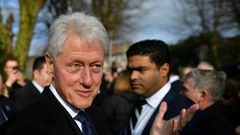 Former US President Bill Clinton speaks to mourners after the funeral of former Northern Ireland Deputy First Minister Martin McGuinness at St Columba's Church Long Tower, in Derry, Northern Ireland on March 23, 2017