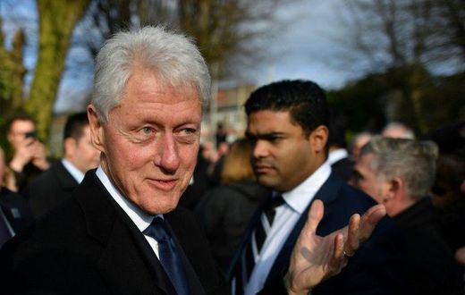 Former US President Bill Clinton speaks to mourners after the funeral of former Northern Ireland Deputy First Minister Martin McGuinness at St Columba's Church Long Tower, in Derry, Northern Ireland on March 23, 2017