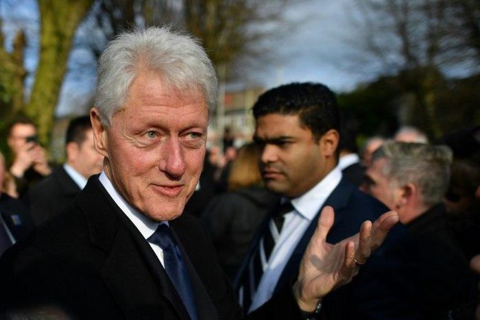 Former US President Bill Clinton speaks to mourners after the funeral of former Northern Ireland Deputy First Minister Martin McGuinness at St Columba's Church Long Tower, in Derry, Northern Ireland on March 23, 2017