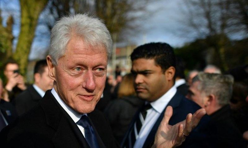 Former US President Bill Clinton speaks to mourners after the funeral of former Northern Ireland Deputy First Minister Martin McGuinness at St Columba's Church Long Tower, in Derry, Northern Ireland on March 23, 2017