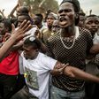 Supporters of now-President Adama Barrow demonstrate on the last day of his presidential campaign in Gambia