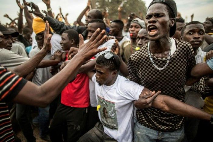 Supporters of now-President Adama Barrow demonstrate on the last day of his presidential campaign in Gambia