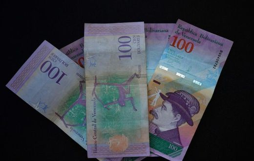 Venezuelan bank notes: the government has devalued the bolivar by nearly 35 percent