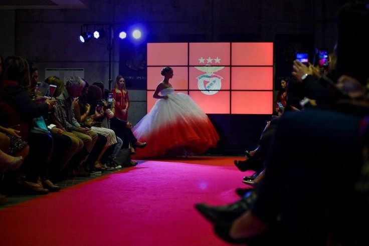 A model wears a creation by designer Micaela Oliveira during a presentation by Portuguese football club Benfica of 24 wedding dresses, 12 evening dresses and four dresses for girls at the Stadium of Light in Lisbon