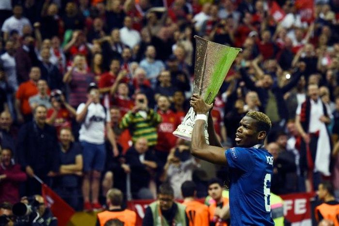 Manchester United's midfielder Paul Pogba celebrates with the trophy after the UEFA Europa League final football match Ajax Amsterdam v Manchester United on May 24, 2017 at the Friends Arena in Solna outside Stockholm