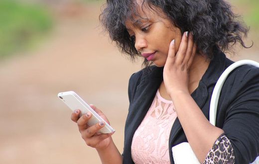 Young lady using phone(psychologytoday)