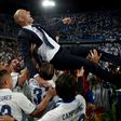 Real Madrid's head coach Zinedine Zidane is tossed by players