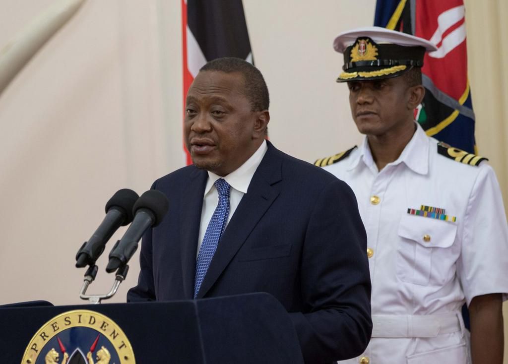 File image of former President Uhuru Kenyatta and his former Aide-de-Camp Major General Timothy Stelu Lekolool at State House Nairobi