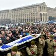 Mourners gather in Kiev's Independence (Maidan) Square on February 1, 2017, as servicemen carry the coffins of soldiers killed in eastern Ukraine