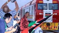 President Uhuru Kenyatta flags off one of the SGR trains during the launch of the cargo service on May 30