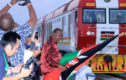 President Uhuru Kenyatta flags off one of the SGR trains during the launch of the cargo service on May 30