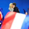 France's incoming president Emmanuel Macron kisses his wife Brigitte after his victory in the first round of the election in April