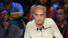 French presidential election candidate for the far-left New Anticapitalist Party (NPA) Philippe Poutou looks on during a debate between the eleven candidates for the French presidential election, on April 4, 2017