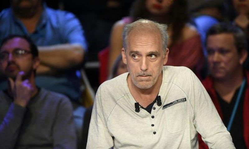 French presidential election candidate for the far-left New Anticapitalist Party (NPA) Philippe Poutou looks on during a debate between the eleven candidates for the French presidential election, on April 4, 2017
