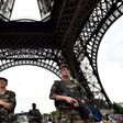 Armed French troops patrol at the Eiffel Tower in Paris