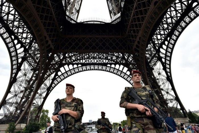 Armed French troops patrol at the Eiffel Tower in Paris