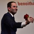Benoit Hamon holds a rose following the first results of the primary's second round on January 29, 2017