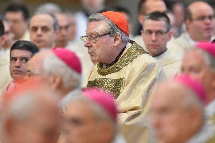 Vatican finance chief, Australian Cardinal George Pell (C) attends a mass for the ordination of new bishops, at St Peter's basilica, on March 19, 2016