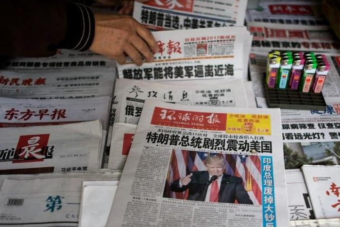 Chinese newspapers feature Donald Trump's victory in Shanghai on November 10, 2016