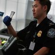The New York Times reported that airport officials began detaining travelers following the president's executive order closing America's borders to refugees