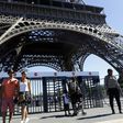 A glass wall will replace metal fences around the Eiffel Tower