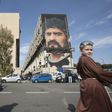 A picture shows the unfinished mural of football superstar Diego Armando Maradona by Italian artist Jorit Agoch in a district known as the "Bronx" in San Giovanni a Teduccio near Naples