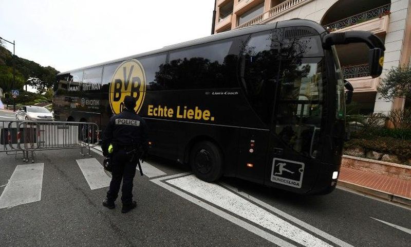 The Dortmund bus arrives under police escort at the Louis II stadium prior to their UEFA Champions League football match against Monaco, on April 19, 2017