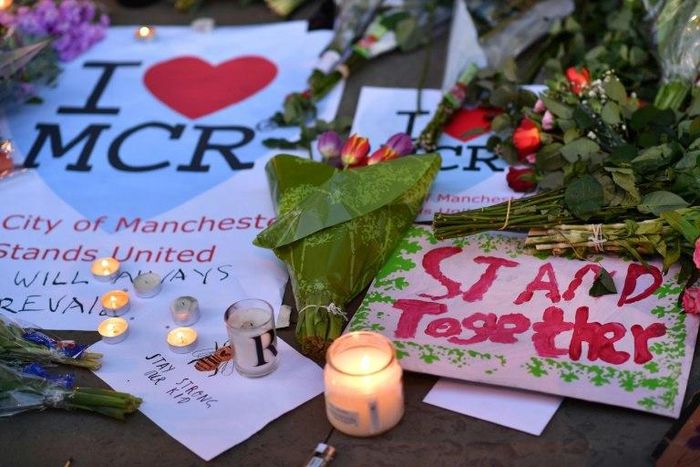 Floral tributes are left for those killed and injured during an Ariana Grande concert at the Manchester Arena