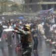 Afghan security forces use water canons to disperse protesters at an anti-government demonstration following a deadly truck bomb attack in Kabul on June 2, 2017