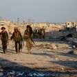 Turkish-backed Syrian rebels patrol through the town of al-Bab shortly after they captured it from the Islamic State (IS) group