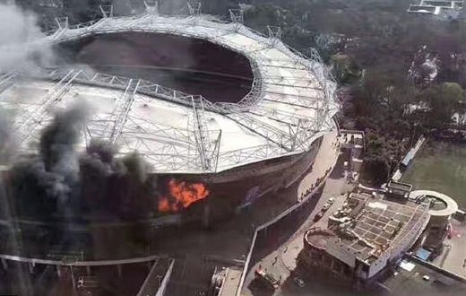 The fire broke out in one corner of the 33,000-capacity stadium, causing considerable damage inside and outside