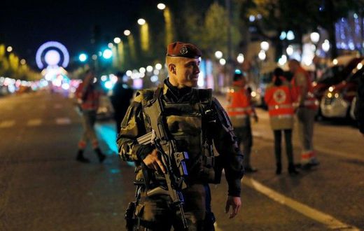A French soldier patrols on the Champs Elysees in Paris after a shooting on April 20, 2017