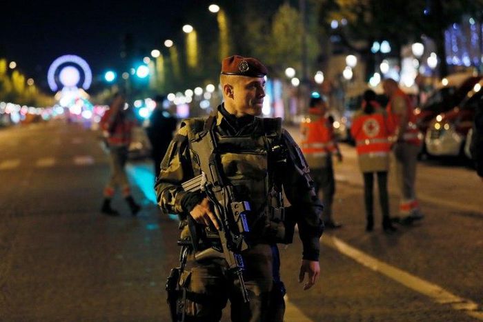 A French soldier patrols on the Champs Elysees in Paris after a shooting on April 20, 2017