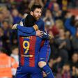 Barcelona's forward Lionel Messi (R) celebrates with Barcelona's forward Luis Suarez after scoring a goal during the Spanish league football match FC Barcelona vs Real Sociedad at the Camp Nou stadium in Barcelona on April 15, 2017