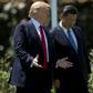 US President Donald Trump (L) and Chinese President Xi Jinping walk together at the Mar-a-Lago estate on April 7, 2017