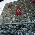 Turkish flags hang from the facade of the damaged Ankara police headquarters after it was bombed during the failed July 15 coup attempt, in a picture taken on July 19, 2016