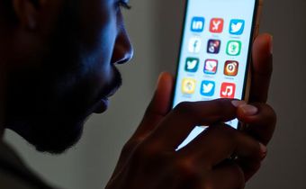 An illustrative image of a man holding a smartphone