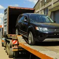 A vehicle being offloaded from a truck