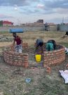 Artisans construct a 3.5-metre diameter custom brick stove, used by content creator Raymond Kahuma in attemting to make the World's Largest Chapati