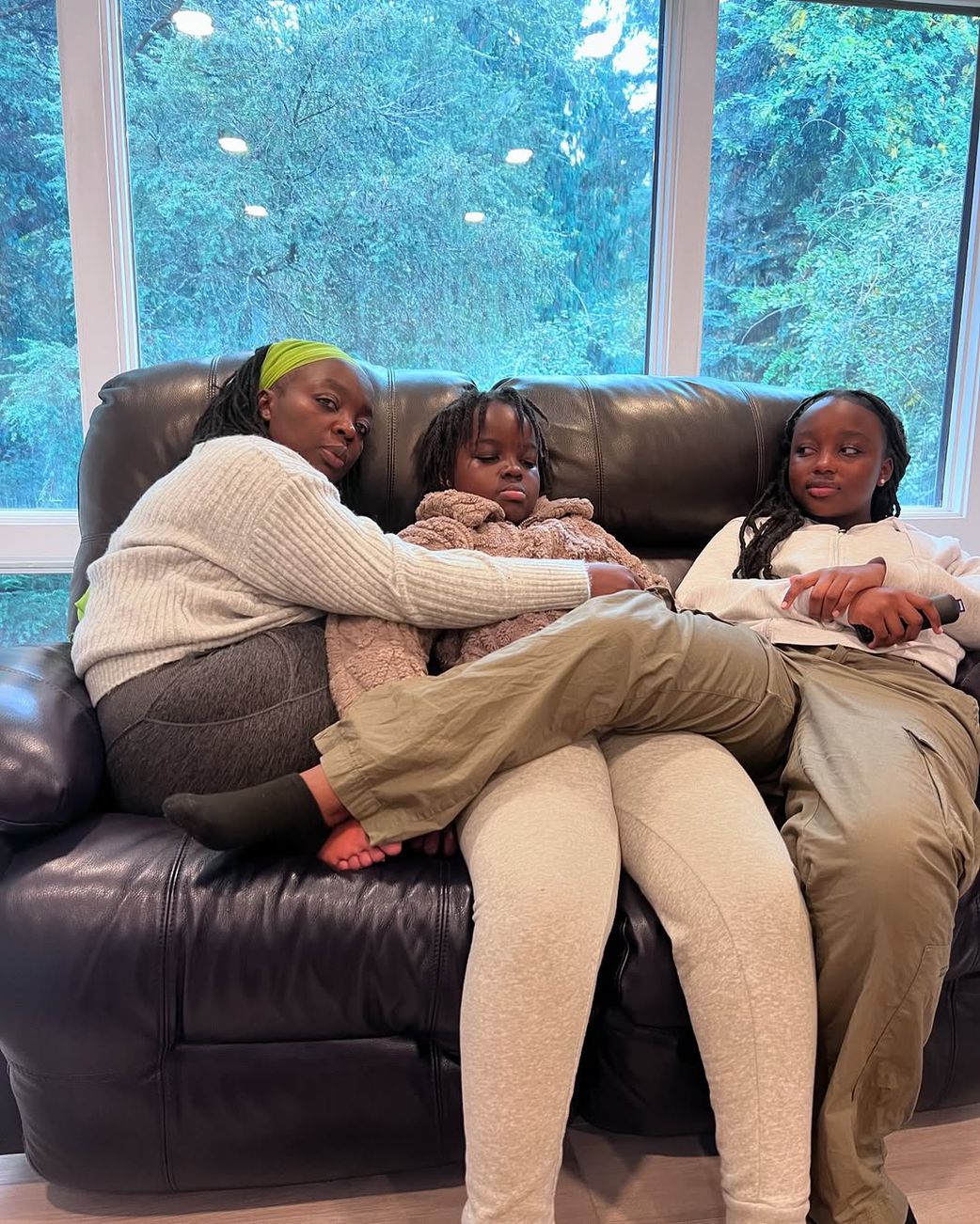 Jeridah Andayi with her daughter's Norah and Neema