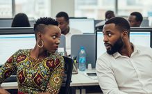 An AI generated image of office colleagues staring at each other