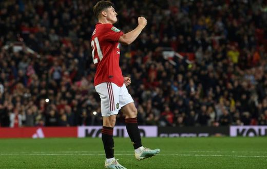 Manchester United midfielder Daniel James celebrates scoring the winning penalty against Rochdale