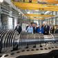 The German economy shrank in the second quarter and could be at risk of recession but German Chancellor Angela Merkel (centre) sees no immediate need for a stimulus package despite strong government finances