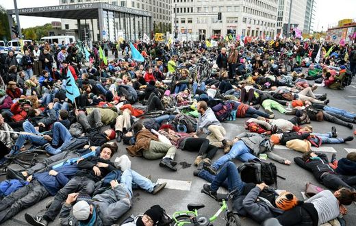Activists from the "Extinction Rebellion" members demonstrate at Potsdamer Platz square in Berlin