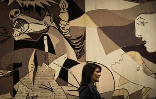 Then-US ambassador to the United Nations Nikki Haley walks past a replica of "Guernica" by Pablo Picasso at the UN headquarters in January 2018