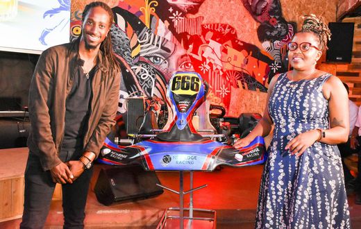JBLESSING (RACER) WITH KBL HEAD OF SPIRITS GRACE NSHEMEIRE GWAKU DURING THE LAUNCH OF JOHNNIE WALKER FORMULA 1 VR & GP KARTING CHAMPIONSHIPS LAUNCH IN NAIROBI (1)