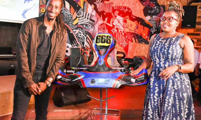 JBLESSING (RACER) WITH KBL HEAD OF SPIRITS GRACE NSHEMEIRE GWAKU DURING THE LAUNCH OF JOHNNIE WALKER FORMULA 1 VR & GP KARTING CHAMPIONSHIPS LAUNCH IN NAIROBI (1)