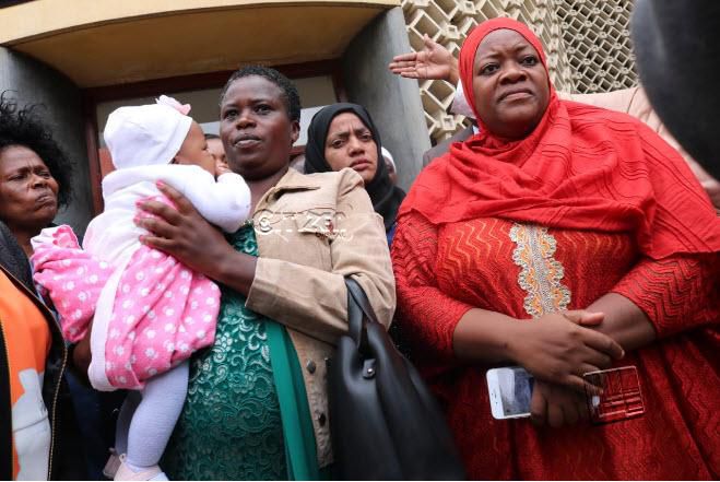 Kwale Woman Rep Zulekha Hassan in red outside Parliament building. (Citizen)